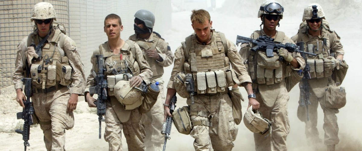 ﻿ A US Navy Corpsman and US Marines in southern Afghanistan (Reuters/Goran Tomasevic)