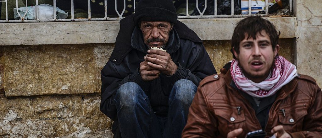 Thousands of Syrians were braving cold and rain at the Turkish border Saturday after fleeing a Russian-backed regime offensive on Aleppo that threatens a fresh humanitarian disaster in the country