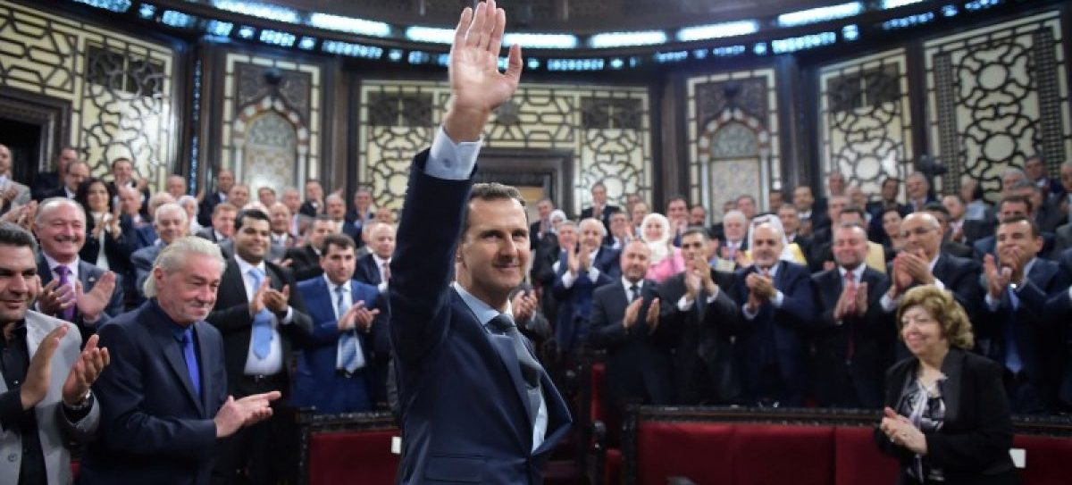 Syria's president Bashar al-Assad gestures while parliament members clap in Damascus, Syria in this handout picture provided by SANA on June 7, 2016. SANA/Handout