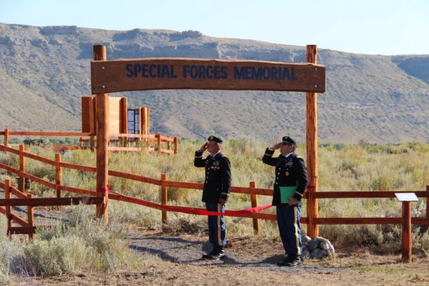 Special Forces Chief Brian Bewley & Major Paul Rosser salute. (Photo: Alex Quade)