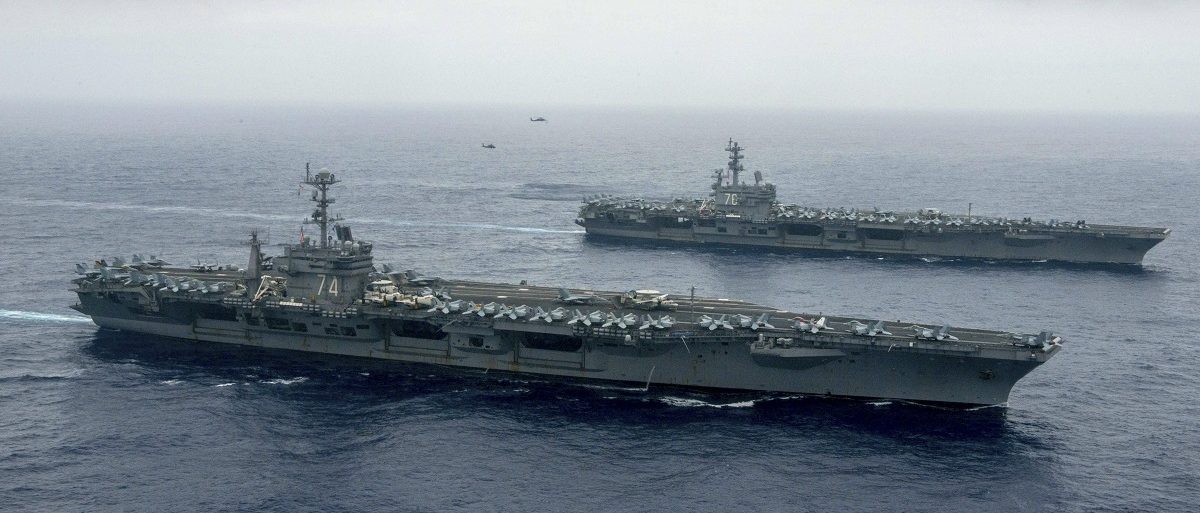 The Nimitz-class aircraft carriers USS John C. Stennis (CVN 74), and USS Ronald Reagan (CVN 76) (rear) conduct dual aircraft carrier strike group operations in the U.S. 7th Fleet area of operations in support of security and stability in the Indo-Asia-Pacific in Philippine Sea on June 18, 2016.   Courtesy Jake Greenberg/U.S. Navy/Handout via REUTERS 