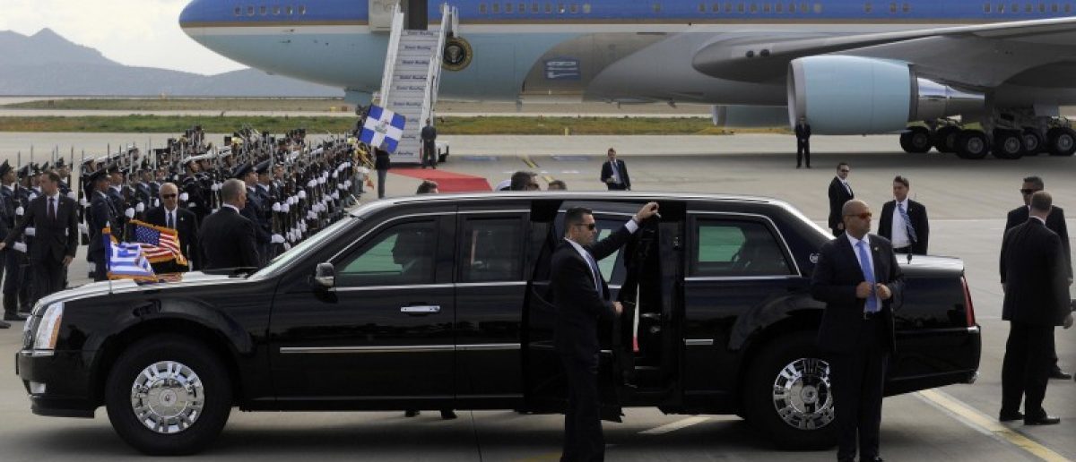 Secret Service agents stand beside the U.S President Barack Obama