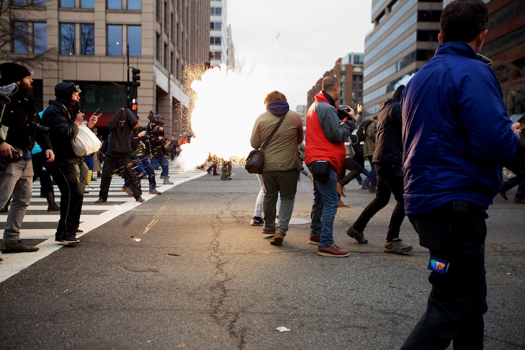 A concussion grenade explodes among protesters and reporters - Daily Caller - Grae Stafford