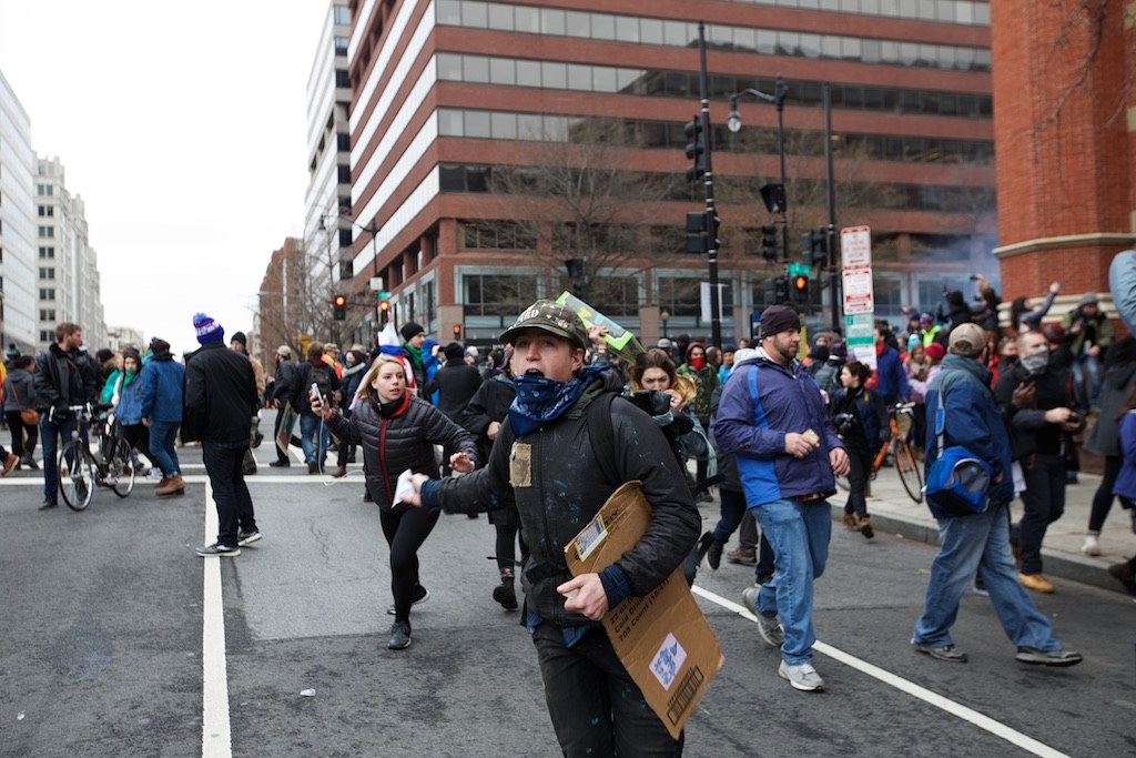 Protesters fleeing from concussion grenades thrown by police - Daily Caller - Grae Stafford