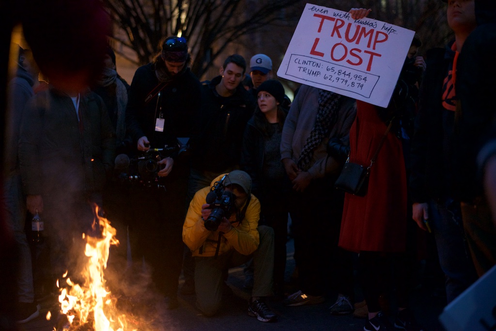 Protestors set fire to inauguration shirts in the streets - Daily Caller - Abbey Jaroma