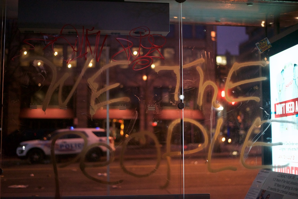 Slogans spray painted on a metro bus shelter - Daily Caller - Abbey Jaroma