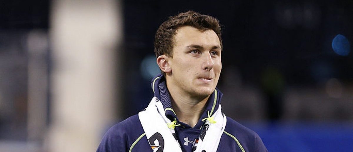 Former Texas A&M quarterback Johnny Manziel looks on as he sits out workouts during the 2014 NFL Combine at Lucas Oil Stadium on February 23, 2014 in Indianapolis, Indiana. (Photo by Joe Robbins/Getty Images)
