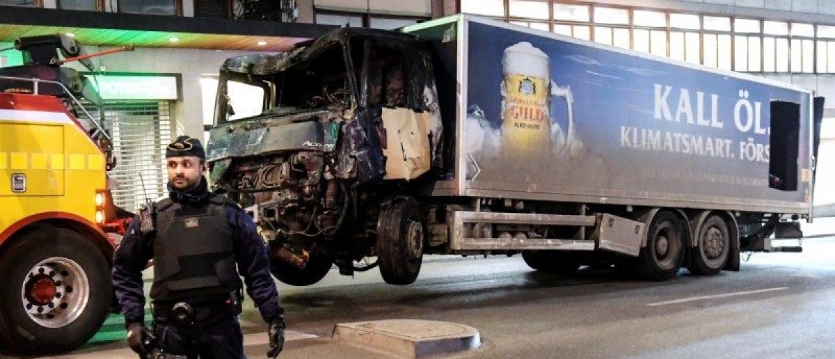 Tow trucks pull away the beer truck that crashed into the department store Ahlens after plowing down the Drottninggatan Street in central Stockholm, Sweden, April 8, 2017. Maja Suslin/TT News Agency/via Reuters