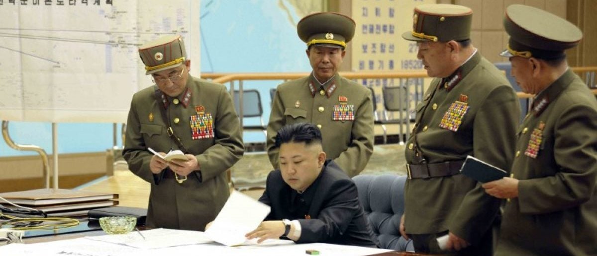 North Korean leader Kim Jong-un presides over an urgent operation meeting on the Korean People's Army Strategic Rocket Force's performance of duty for firepower strike at the Supreme Command in Pyongyang. The sign on the left reads, "Strategic force's plan to hit the mainland of the U.S.". REUTERS/KCNA