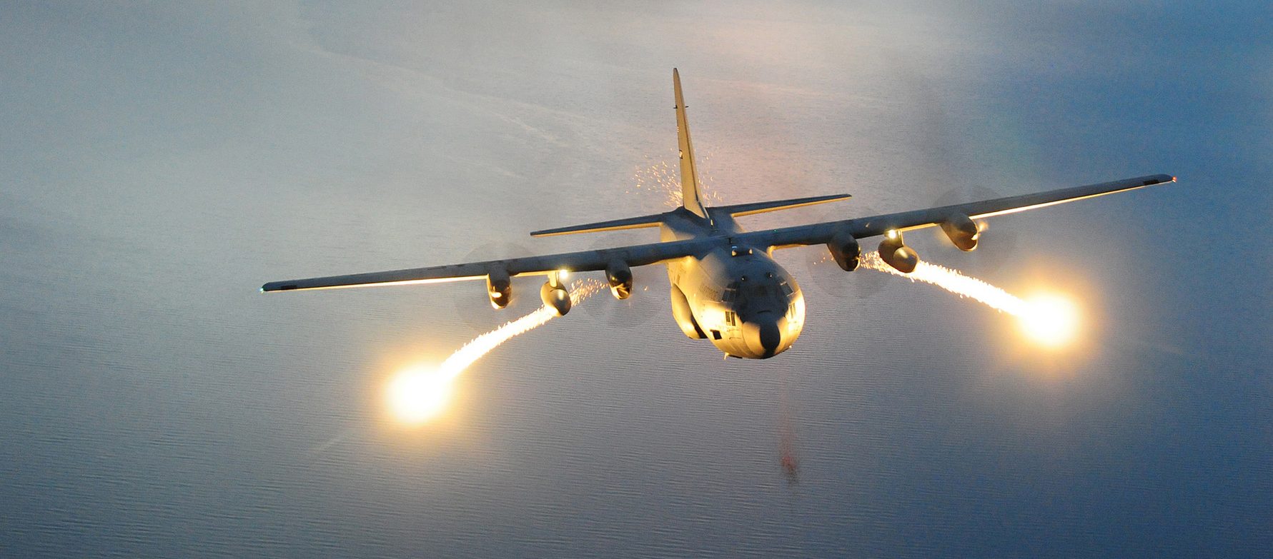 A U.S. Air Force C-130 Hercules cargo aircraft with the 107th Airlift Wing fires off flares during a night formation training mission. A flare is an aerial infrared countermeasure to counter and infrared homing (heat seeking) surface-to-air or air-to-air missile. (U.S. Air Force photo by Senior Master Sgt. Ray Lloyd)