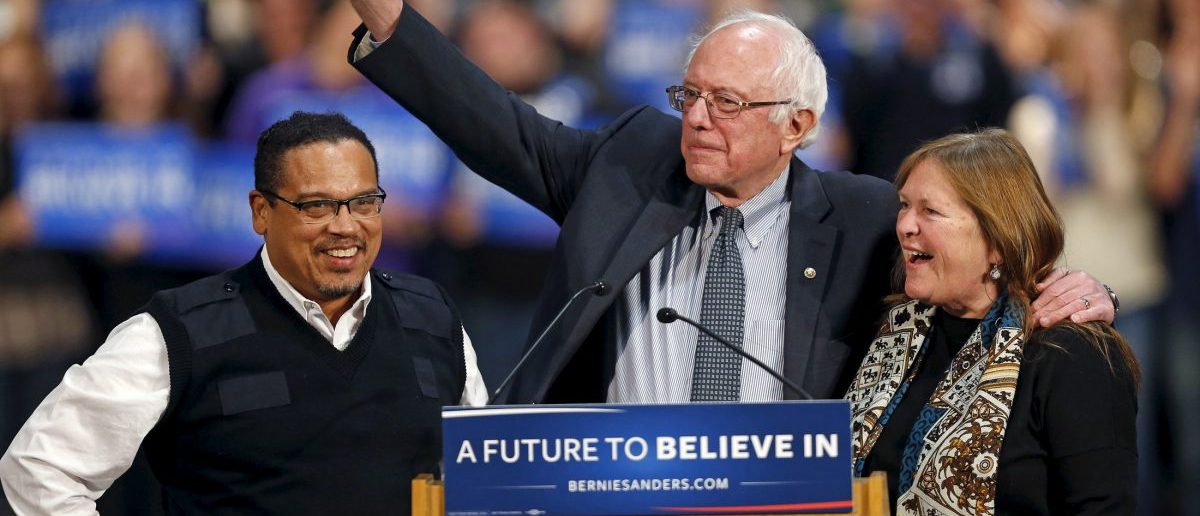 U.S. Democratic presidential candidate Bernie Sanders (C) stands on stage with his wife, Jane O'Meara Sanders (R), and U.S. Rep. Keith Ellison (DFL-MN) before speaking to supporters during a campaign rally in St. Paul, Minnesota, January 26, 2016. REUTERS/Eric Miller