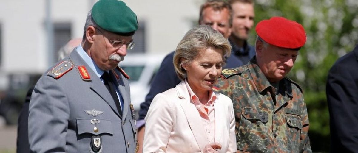 German Defence Minister Ursula von der Leyen (C) walks with General Joerg Vollmer, General Inspector of the German Land Army (L), and General Volker Wieker, Inspector General of Germany's Armed Forces in Bundeswehr, during her visit at the 291st fighter squadron based at the "Quartier Leclerc", a military facility for French and German military units in Illkirch-Graffenstaden near Strasbourg, France May 3, 2017. REUTERS/Vincent Kessler