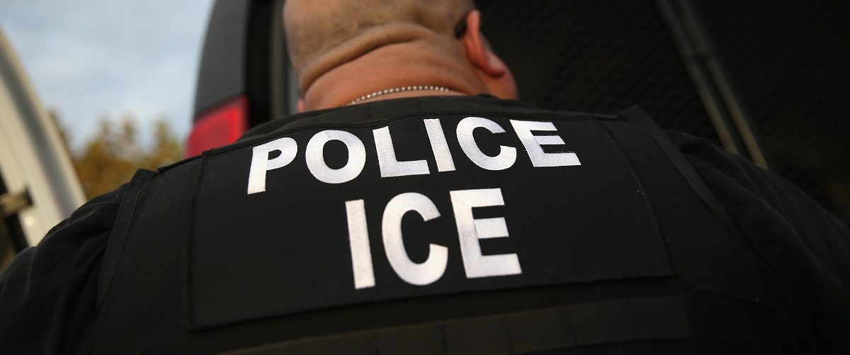 U.S. Immigration and Customs Enforcement (ICE), agents detain an immigrant on October 14, 2015 in Los Angeles, California. ICE agents said the immigrant, a legal resident with a Green Card, was a convicted criminal and member of the Alabama Street Gang in the Canoga Park area. ICE builds deportation cases against thousands of immigrants living in the United States. Green Card holders are also vulnerable to deportation if convicted of certain crimes. The number of ICE detentions and deportations from California has dropped since the state passed the Trust Act in October 2013, which set limits on California state law enforcement cooperation with federal immigration authorities. John Moore/Getty Images.