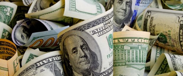 Piles of cash. Rrraum/Shutterstock | FBI Specialist Stole $160k In Funds
