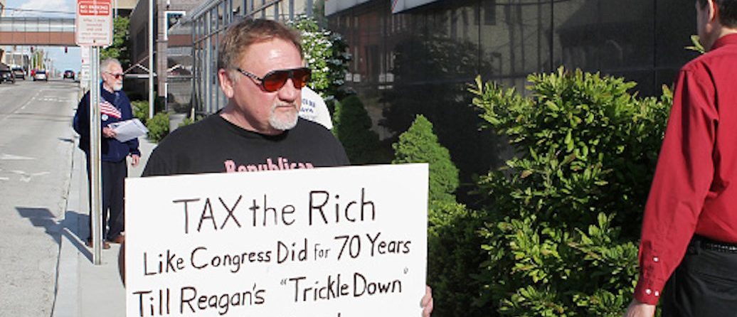 James Hodgkinson of Belleville protests outside of the United States Post Office in Downtown Belleville Tuesday. Hodgkinson is part of the "99%" team drawing attention to the disproportionate amount of money and political power the top 1% of Americans have acquired. Also protesting outside of the post office where members of the Communications Workers of America Local 4217 they were drawing attention to the low percentage of taxes paid by AT&T. (Derik Holtmann/Belleville News-Democrat/TNS via Getty Images)
