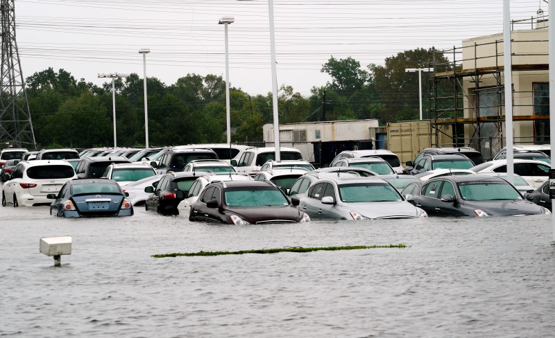 A car dealership is covered by Hurricane Harvey floodwaters near Houston, Texas August 29, 2017. REUTERS/Rick Wilking