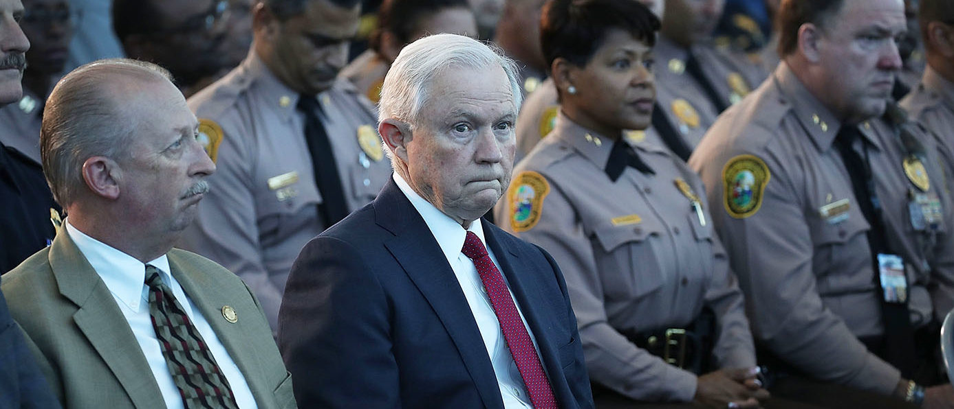 U.S. Attorney General Jeff Sessions waits to be introduced to speak at PortMiami on what he said is a growing trend of violent crime in sanctuary cities on August 16, 2017 in Miami, Florida. The speech highlighted jurisdictions like Miami-Dade that Mr. Sessions told the audience have increased their cooperation and information sharing with federal immigration authorities and have demonstrated a fundamental commitment to the rule of law and lowering violent crime. (Photo by Joe Raedle/Getty Images)
