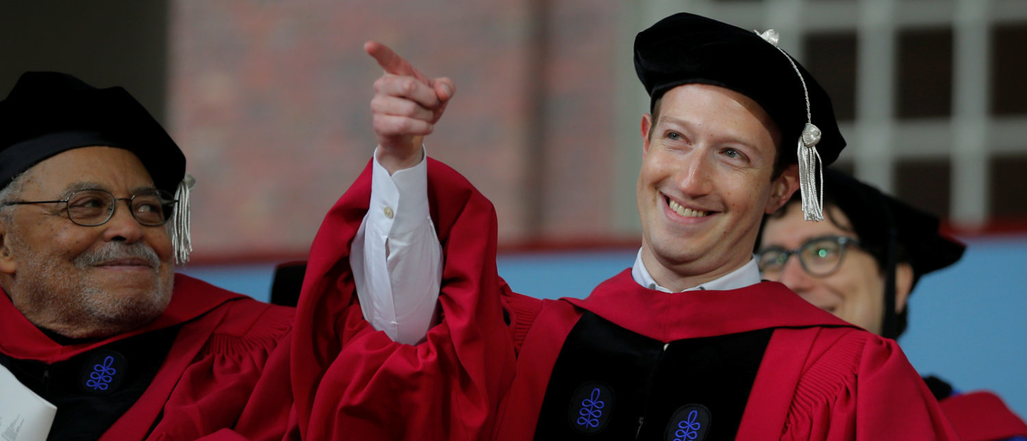 Facebook founder Mark Zuckerberg acknowledges a cheer from the crowd before receiving an honorary Doctor of Laws degree, as fellow honorary degree recipient actor James Earl Jones (L) looks on, during the 366th Commencement Exercises at Harvard University in Cambridge, Massachusetts, U.S., May 25, 2017.   REUTERS/Brian Snyder