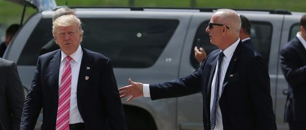 Donald Trump walking on the tarmac in Detroit last September, surrounded by security officials. Keith Schiller, right, served as the Trump campaign's security chief. Photo by Carlo Allegri/REUTERS