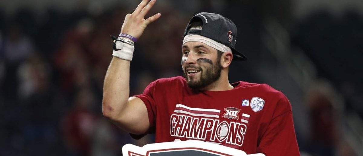 ARLINGTON, TX - DECEMBER 2: Baker Mayfield #6 of the Oklahoma Sooners celebrates after defeating the TCU Horned Frogs 41-17 in the Big 12 Championship AT&T Stadium on December 2, 2017 in Arlington, Texas. (Photo by Ron Jenkins/Getty Images)