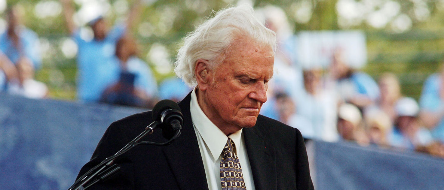 FILE PHOTO: Evangelist Billy Graham speaks during the final day of his Crusade at Flushing Meadows Park in New York June 26, 2005. REUTERS/Keith Bedford /File Photo
