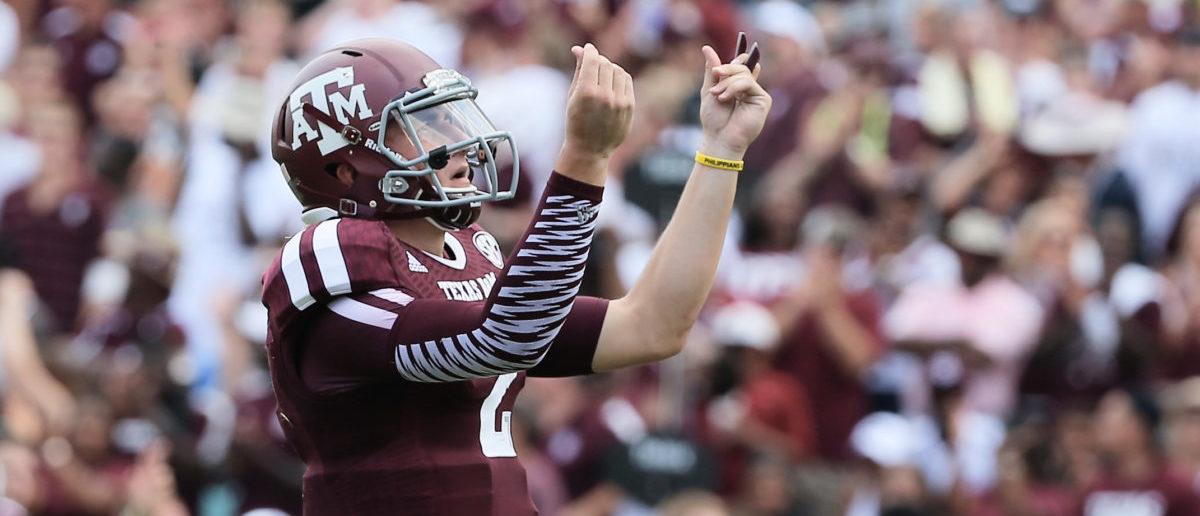 COLLEGE STATION, TX - AUGUST 31:  Johnny Manziel #2 of the Texas A&M Aggies celebrates a third quarter touchdown during the game against the Rice Owls at Kyle Field on August 31, 2013 in College Station, Texas.  (Photo by Scott Halleran/Getty Images)