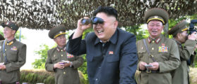 North Korean leader Kim Jong Un looks through a pair of binoculars during an inspection of the Hwa Islet Defence Detachment standing guard over a forward post off the east coast of the Korean peninsula, in this undated photo released by North Korea's Korean Central News Agency (KCNA) in Pyongyang on July 1, 2014. REUTERS/KCNA