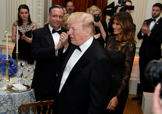 President Donald Trump and first lady Melania Trump arrive in the State Dining Room, where Trump will address the nation's governors, in town for their Annual Winter Meetings, as he hosts the Governor's Ball at the White House, Washington, DC, U.S., February 25, 2018. REUTERS/Mike Theiler - RC177B181080