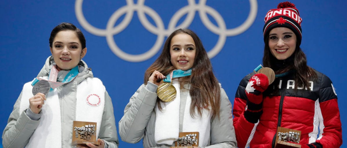 Medals Ceremony - Figure Skating - Pyeongchang 2018 Winter Olympics - Women Single Skating free skating  - Medals Plaza - Pyeongchang, South Korea - February 23, 2018 - Gold medalist Alina Zagitova, an Olympic Athlete from Russia, silver medalist Evgenia Medvedeva, an Olympic Athlete from Russia, and bronze medalist Kaetlyn Osmond of Canada on the podium. REUTERS/Eric Gaillard