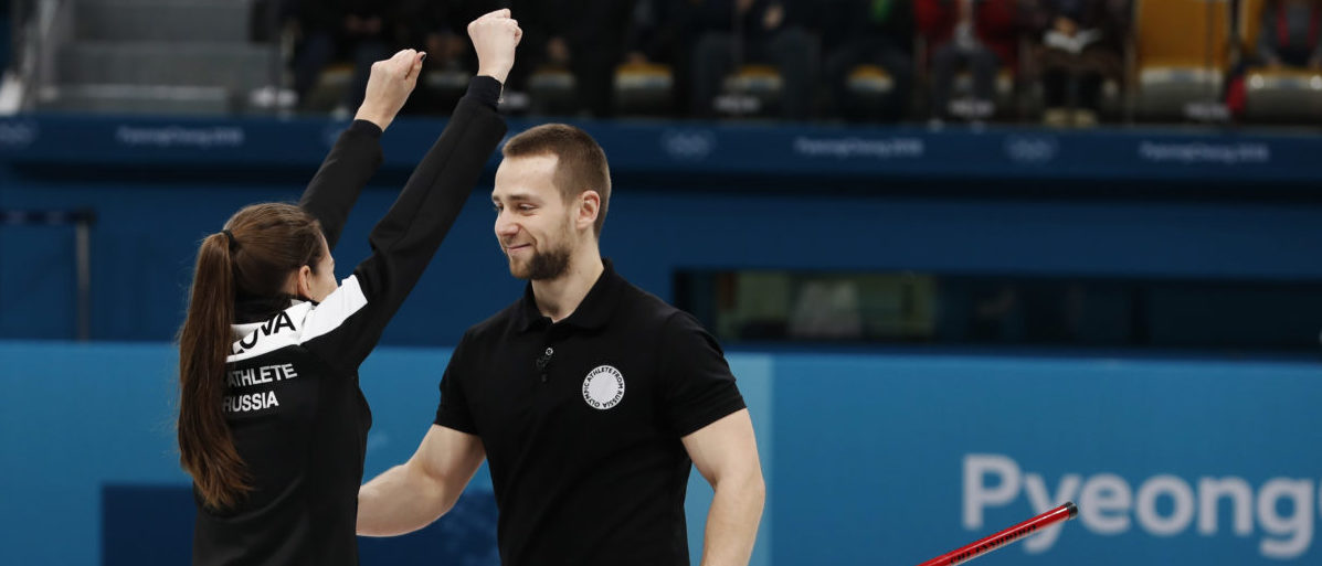 Curling � Pyeongchang 2018 Winter Olympics � Mixed Doubles Bronze Medal Match - Olympic Athletes from Russia v Norway - Gangneung Curling Center - Gangneung, South Korea � February 13, 2018 - Aleksandr Krushelnitckii and Anastasia Bryzgalova, Olympic athletes from Russia, celebrate after winning the bronze. Picture taken February 13, 2018. REUTERS/Cathal McNaughton