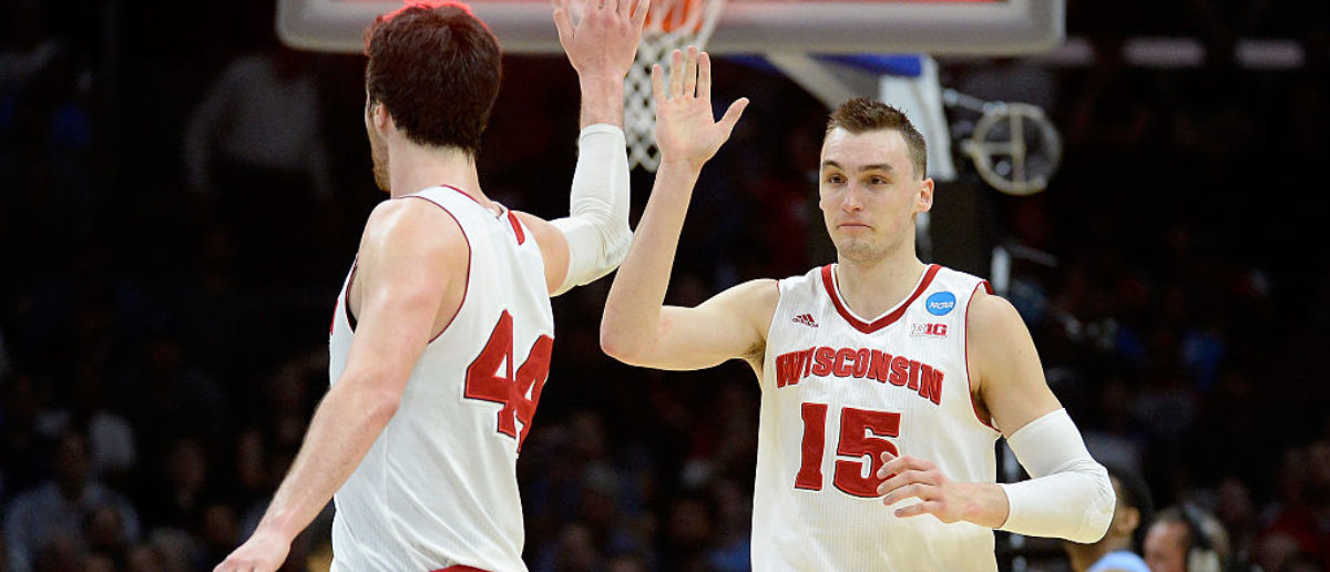 LOS ANGELES, CA - MARCH 26:  Sam Dekker #15 of the Wisconsin Badgers celebrates with Frank Kaminsky #44 after Dekker scores at the end of the first half against the North Carolina Tar Heels during the West Regional Semifinal of the 2015 NCAA Men's Basketball Tournament at Staples Center on March 26, 2015 in Los Angeles, California.  (Photo by Harry How/Getty Images)
