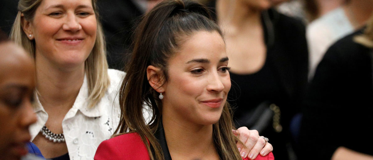 REFILE - CORRECTING IDENTITY OF ALY RAISMAN Victim and Olympic gold medalist Aly Raisman sits after speaking at the sentencing hearing for Larry Nassar, a former team USA Gymnastics doctor who pleaded guilty in November 2017 to sexual assault charges, in Lansing, Michigan, U.S., January 19, 2018. REUTERS/Brendan McDermid | Nassar Victims Make A Major Concession