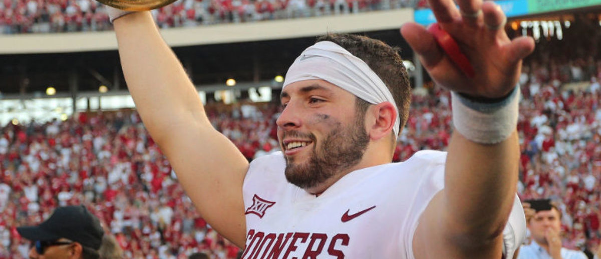 DALLAS, TX - OCTOBER 14:  Baker Mayfield #6 of the Oklahoma Sooners waves the Golden Hat Trophy after the 29-24 win over the Texas Longhorns at Cotton Bowl on October 14, 2017 in Dallas, Texas. (Photo by Richard W.  Rodriguez/Getty Images)