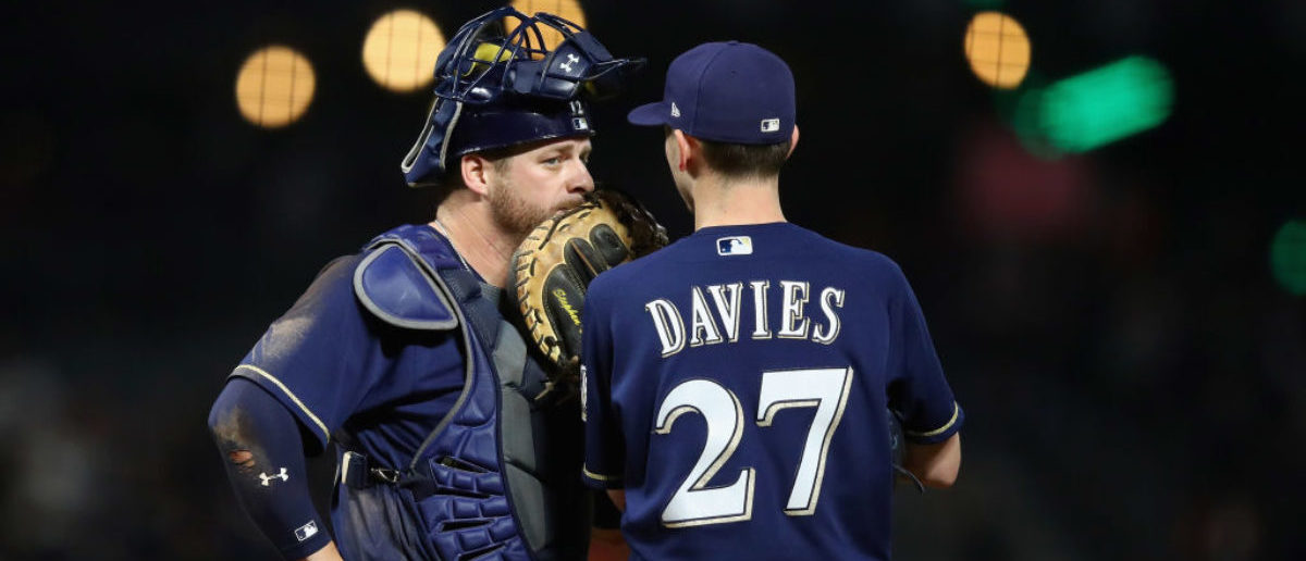 SAN FRANCISCO, CA - AUGUST 21: Stephen Vogt #12 talks to starting pitcher Zach Davies #27 of the Milwaukee Brewers during their game against the San Francisco Giants at AT&T Park on August 21, 2017 in San Francisco, California.  (Photo by Ezra Shaw/Getty Images)