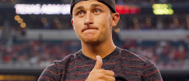 ARLINGTON, TX - SEPTEMBER 27:  Johnny Manziel #2 of the Cleveland Browns reacts after receiving his Aggie Ring during half time of the Southwest Classic at AT&T Stadium on September 27, 2014 in Arlington, Texas.  (Photo by Tom Pennington/Getty Images)