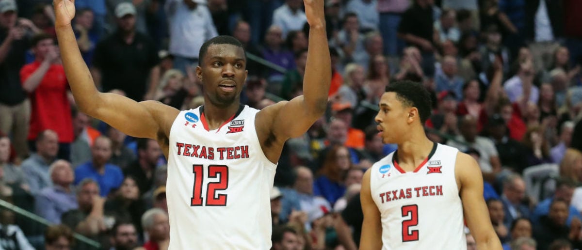 DALLAS, TX - MARCH 15: Keenan Evans #12 of the Texas Tech Red Raiders celebrate alongside teammate Zhaire Smith #2 in the second half against the Stephen F. Austin Lumberjacks in the first round of the 2018 NCAA Men's Basketball Tournament at American Airlines Center on March 15, 2018 in Dallas, Texas. The Texas Tech Red Raiders won 70-60. (Photo by Tom Pennington/Getty Images)