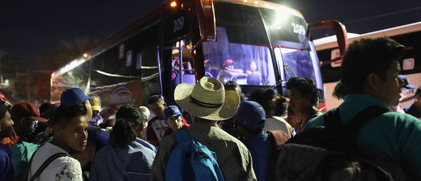 Central American asylum seekers wait for buses to take them to Tijuana on the U.S.-Mexico border on April 24, 2018 from Hermosillo, Mexico. More than 300 immigrants, the remnants of a caravan of Central Americans that began almost a month before set out on the last leg of their journey north in Mexico. President Trump sent National Guard troops to U.S. border regions in response to the caravan weeks before, although many in the group are families who plan to seek political asylum the U.S. (Photo by John Moore/Getty Images)
