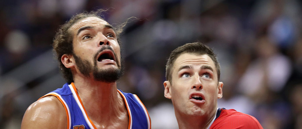 WASHINGTON, DC - NOVEMBER 17: Joakim Noah #13 of the New York Knicks and Jason Smith #14 of the Washington Wizards go for a rebound at Verizon Center on November 17, 2016 in Washington, DC. NOTE TO USER: User expressly acknowledges and agrees that, by downloading and or using this photograph, User is consenting to the terms and conditions of the Getty Images License Agreement.  (Photo by Rob Carr/Getty Images)