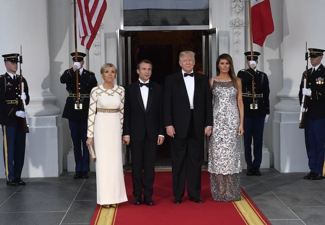 US President Donald Trump and First Lady Melania Trump welcome French President Emmanuel Macron and his wife, Brigitte Macron, as they arrive for a State Dinner at the North Portico of the White House in Washington, DC, April 24, 2018. (Photo by SAUL LOEB / AFP) (Photo credit should read SAUL LOEB/AFP/Getty Images)