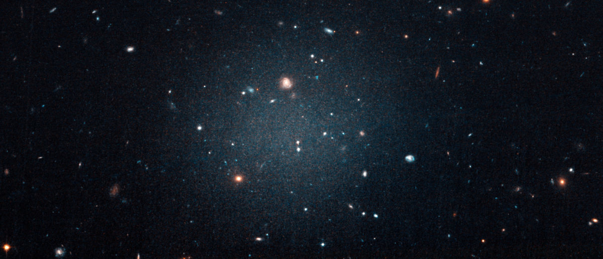 The galaxy named NGC 1052-DF2, a large fuzzy-looking galaxy so diffused that astronomers call it a 'see-through' galaxy because its missing most, if not all of its dark matter, is shown in this photo obtained from NASA on March 28, 2018.    NASA, ESA, and P. van Dokkum (Yale University)/Handout via REUTERS | Luxury Space Hotel Set To Open In 2022