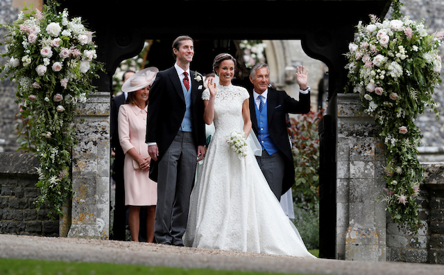 FILE PHOTO: David Matthews (right) waves to well-wishers at the wedding of his son James Matthews and Pippa Middleton at St Mark's Church in Englefield, Britain, May 20, 2017. REUTERS/Kirsty Wigglesworth/Pool/File Photo - RC1FC0A907D0