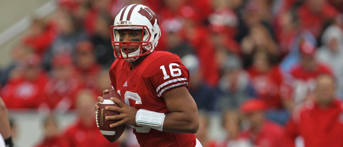 MADISON, WI - SEPTEMBER 24: Russell Wilson #16 of the Wisconsin Badgers looks for a receiver against the South Dakota Coyotes at Camp Randall Stadium on September 24, 2011 in Madison Wisconsin. Wisconsin defeated South Dakota 59-10. (Photo by Jonathan Daniel/Getty Images)