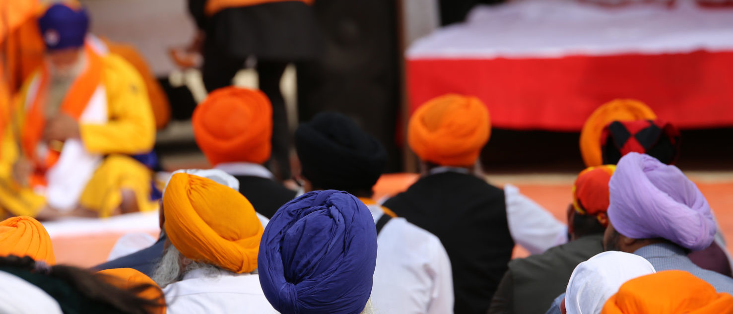 A group of Sikh men attend a religious ceremony (Shutterstock/ ChiccoDodiFC)