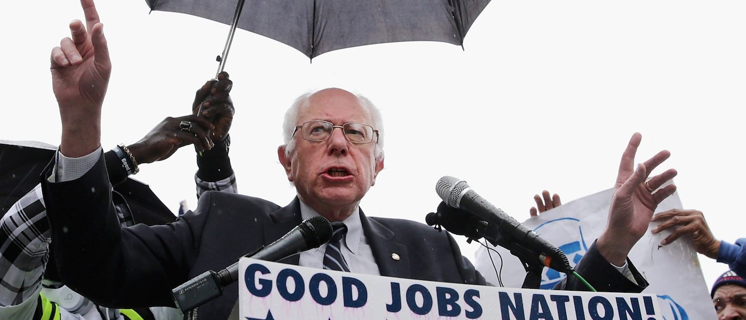 Democratic presidential candidate Sen. Bernie Sanders (I-VT) (C) addresses a rally with protesters calling for higher wages for federal contract workers in the rain on Capitol Hill November 10, 2015 in Washington, DC. (Photo: Chip Somodevilla/Getty Images)