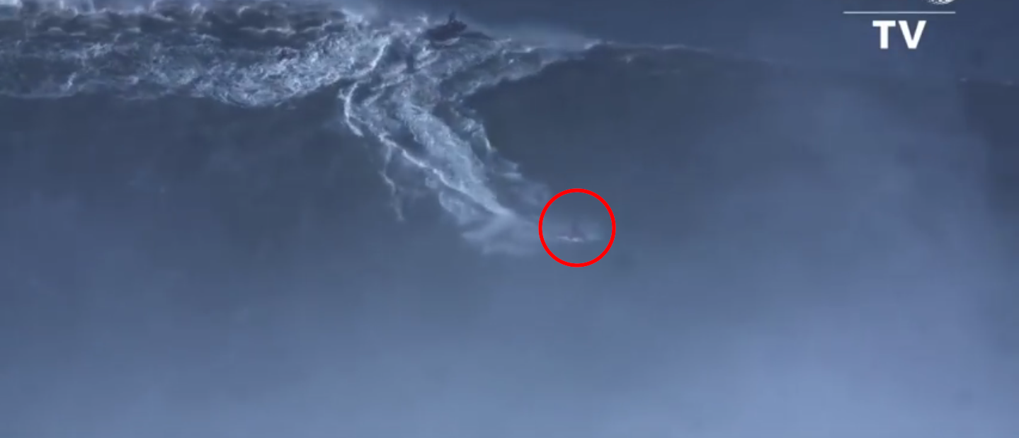 Brazil's Rodrigo Koxa surfed a record-breaking 80-foot wave. (Screenshot/YouTube/AFP News Agency)