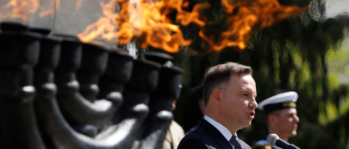 Poland's President Andrzej Duda speaks during a ceremony commemorating the 75th anniversary of the Warsaw Ghetto Uprising, in front of the Warsaw Ghetto monument in Warsaw, Poland April 19, 2018. REUTERS/Kacper Pempel | Poland Wants To Pay US For Military Base