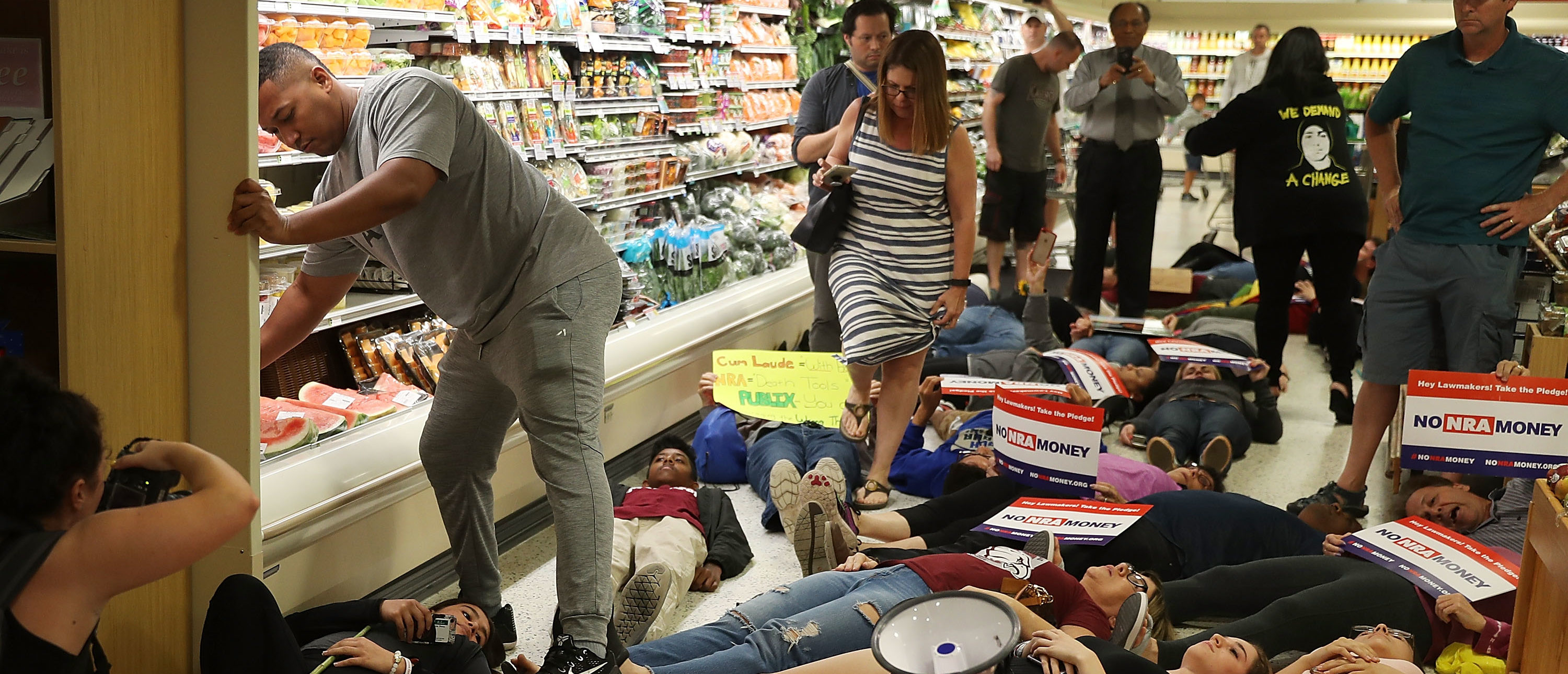 CORAL SPRINGS, FL - MAY 25: Protesters participate in a "die'-in" protest in a Publix supermarket on May 25, 2018 in Coral Springs, Florida. The activists many of whom are Marjory Stoneman Douglas High School students entered the Publix store to protest against the company's support of political candidates endorsed by the National Rifle Association who oppose gun reform. (Photo by Joe Raedle/Getty Images)