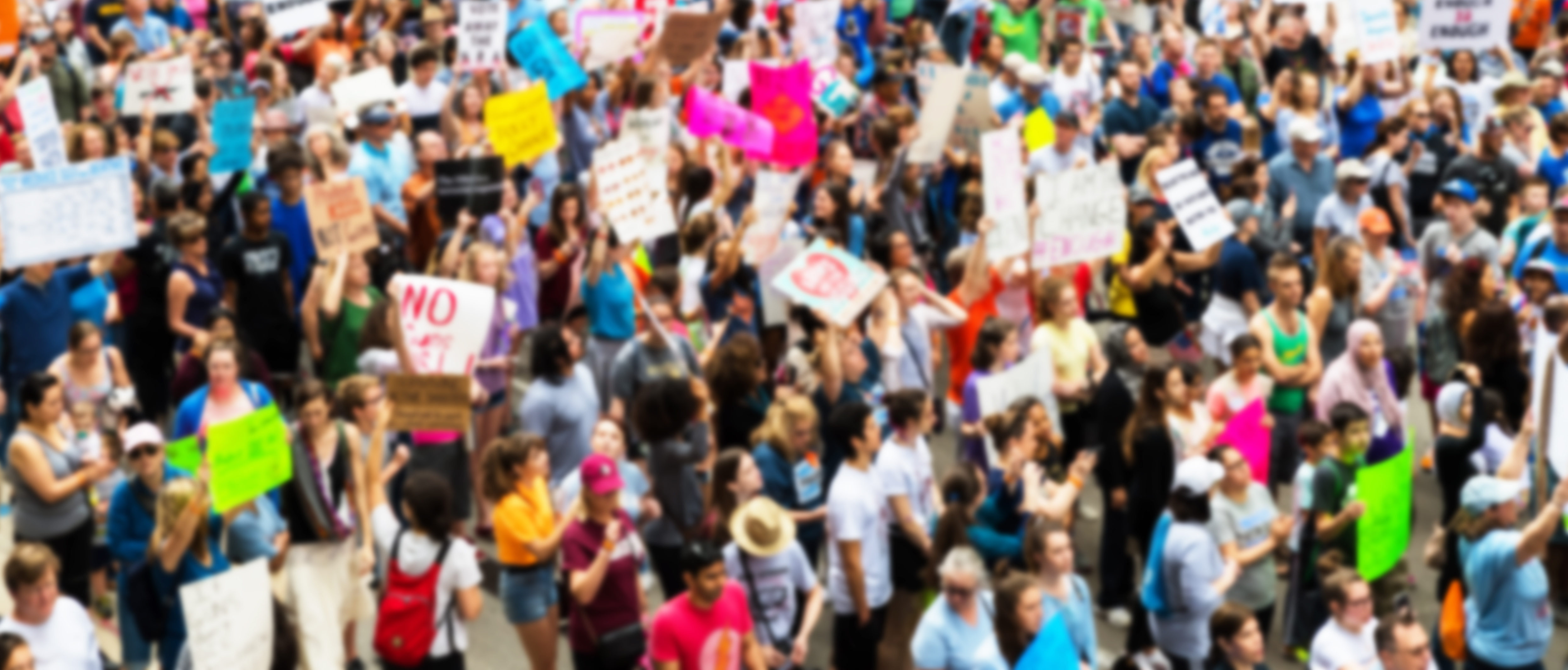 Huge crowd marching (Shutterstock/ michelmond)