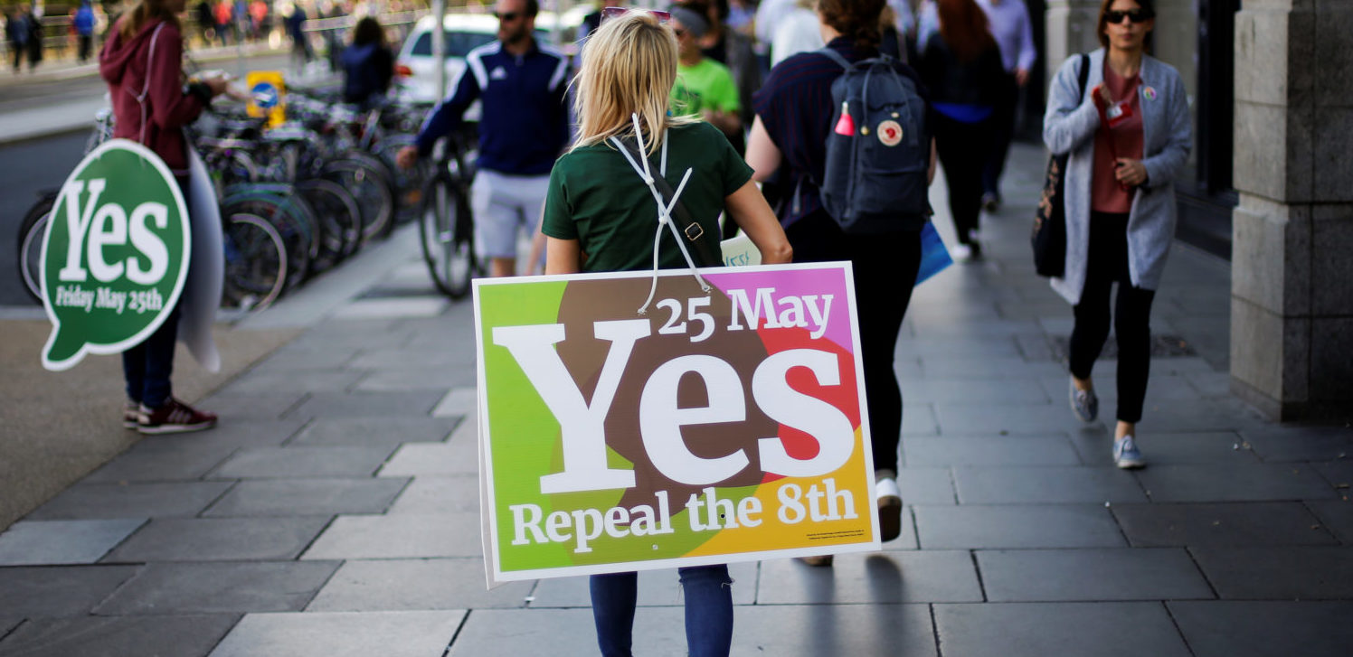 A woman carries a placard as Ireland holds a referendum on liberalising abortion laws, in Dublin, Ireland, May 25, 2018. REUTERS/Max Rossi