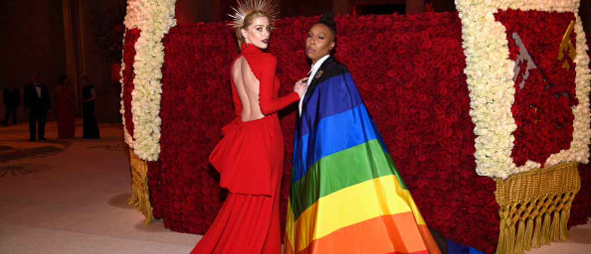 NEW YORK, NY - MAY 07: Amber Heard and Lena Waithe attend the Heavenly Bodies: Fashion & The Catholic Imagination Costume Institute Gala at The Metropolitan Museum of Art on May 7, 2018 in New York City.  (Photo by Kevin Mazur/MG18/Getty Images for The Met Museum/Vogue)